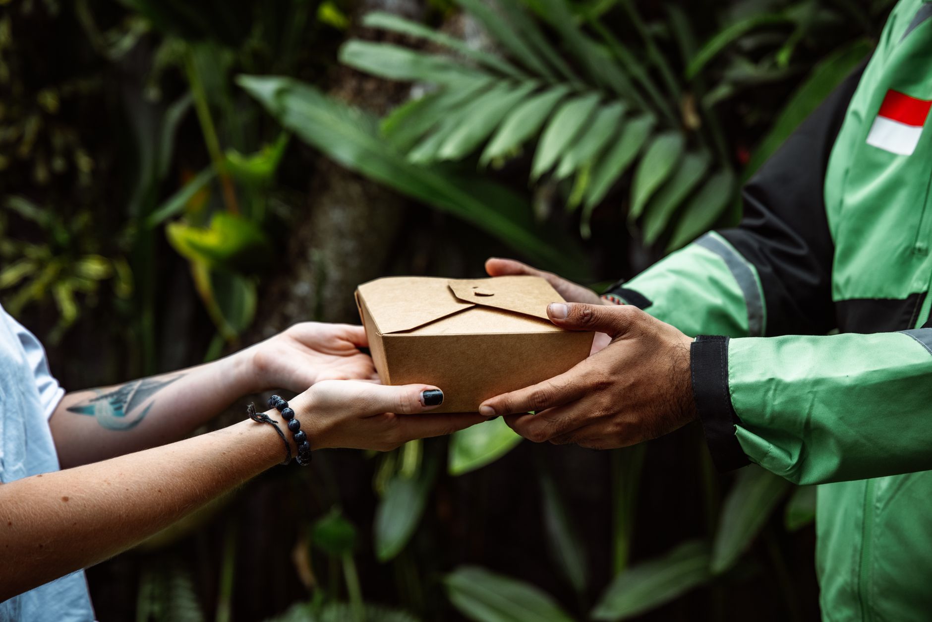 Commercial kitchen preparing multiple food delivery orders — dark kitchens fake restaurant names UK