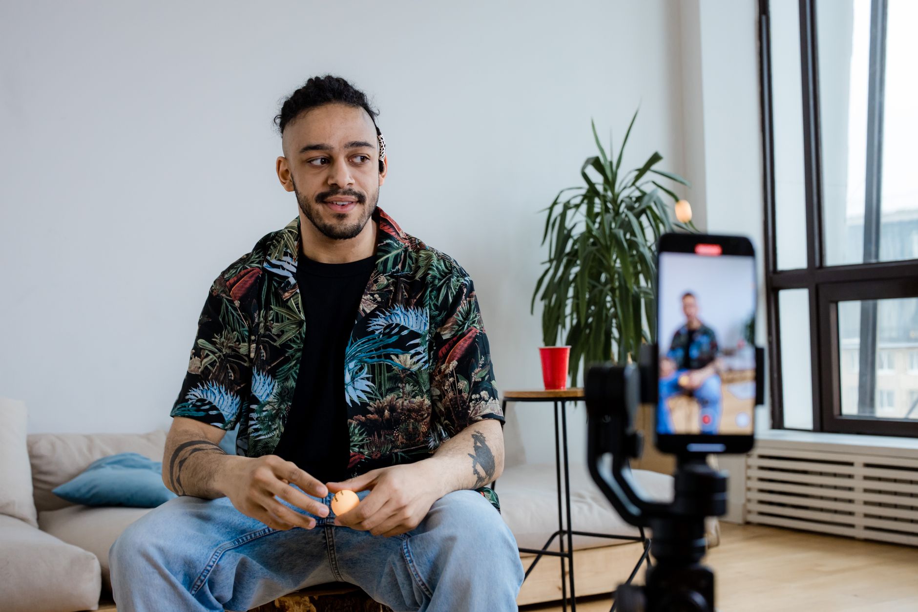 Content creator filming for social media, reflecting how Ofcom Online Safety Act social media rules UK affect creators and influencers
