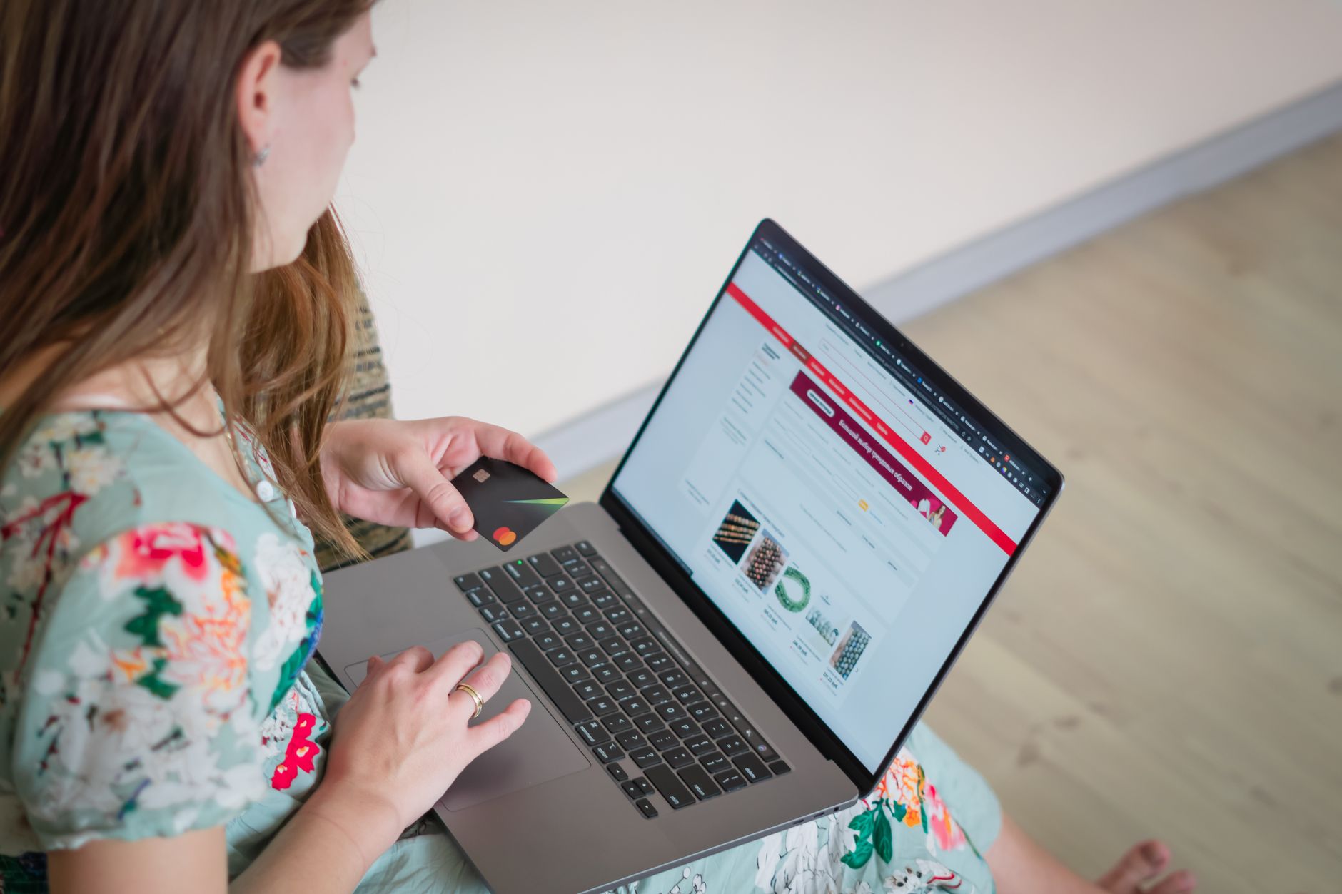 Person shopping online for ghost brands UK online retail products on a laptop at home
