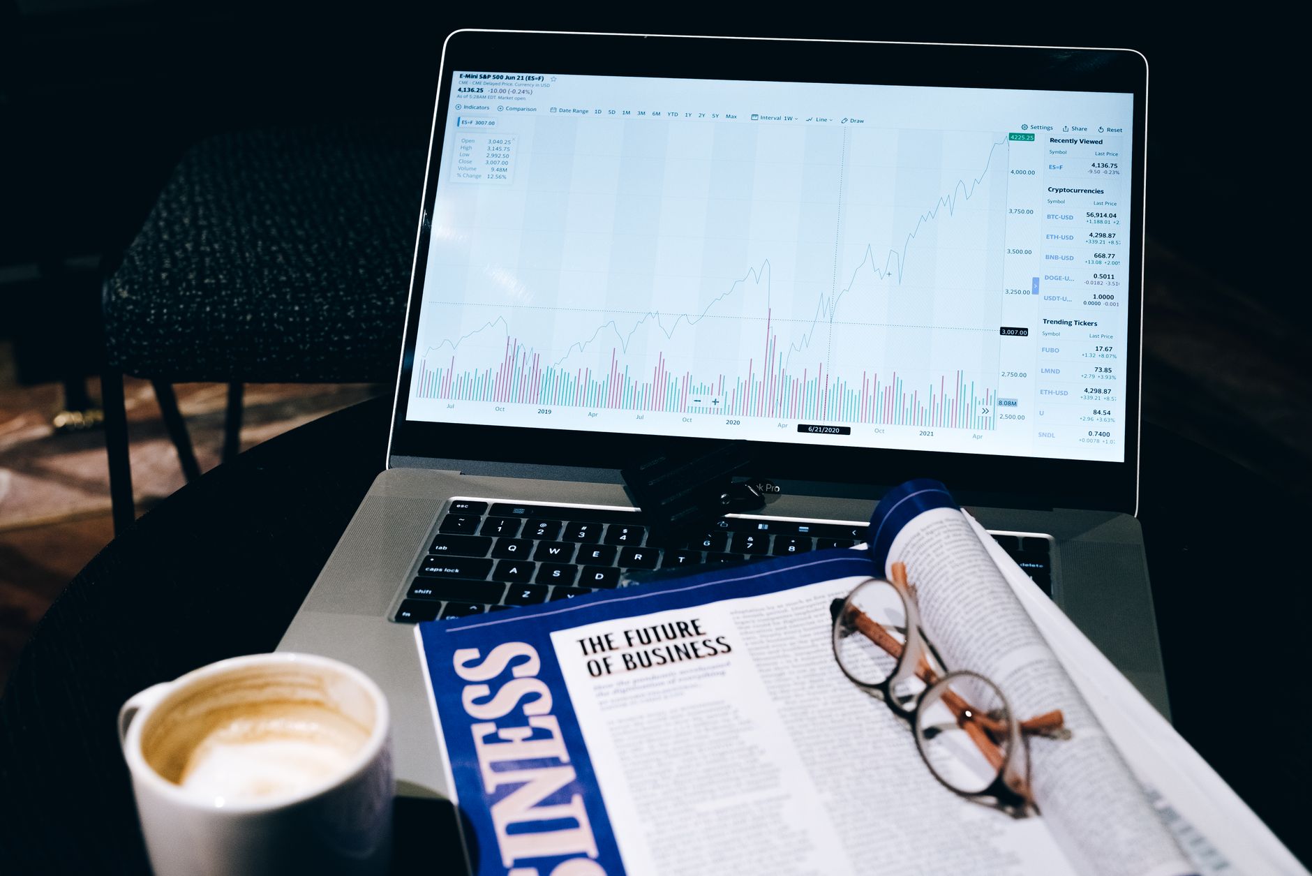 Investment charts on a laptop screen illustrating finfluencer regulation UK FCA concerns